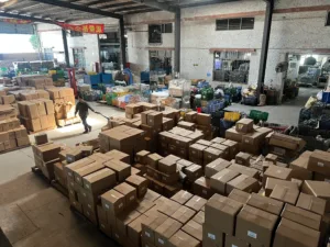 Professional kitchenware factory floor in China showing mass production of aluminum cookware.